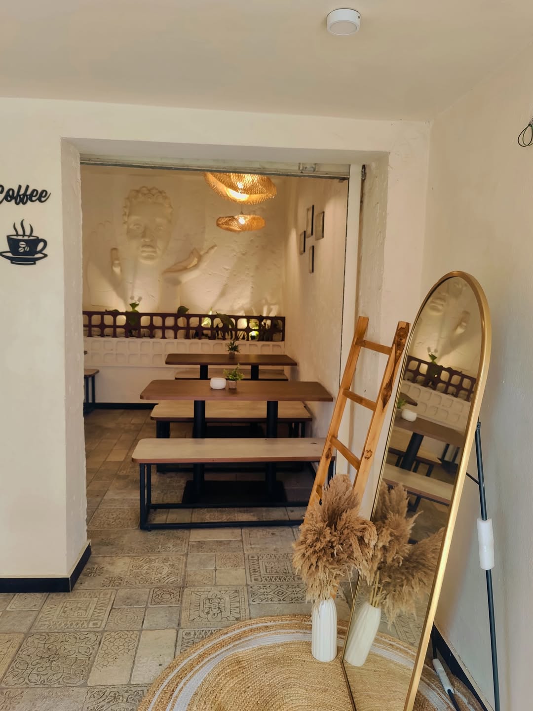 Entrance and seating with the signature relief wall